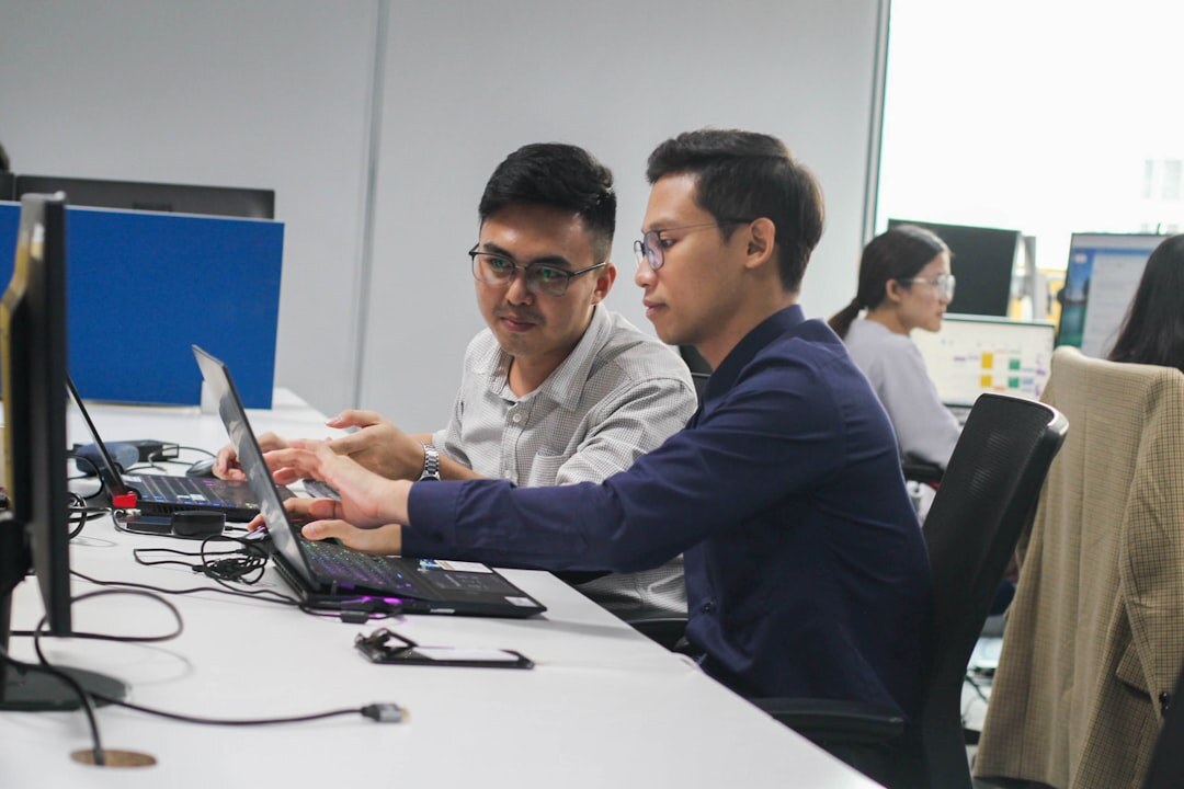 Team of security experts reviewing a threat report together