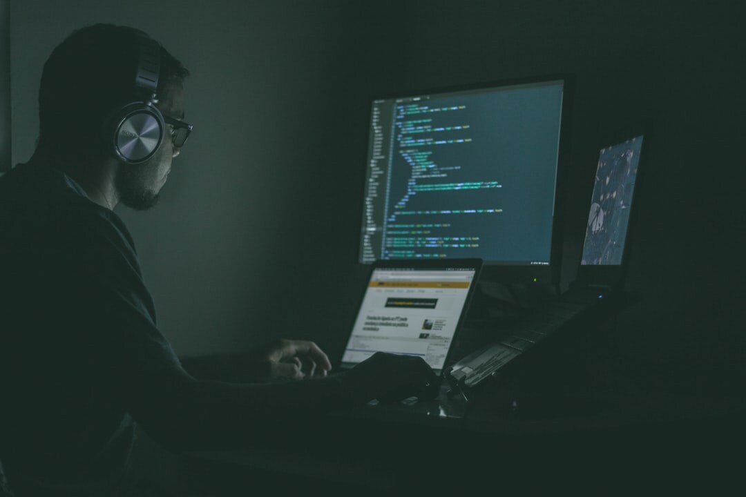 Cybersecurity analyst monitoring network security screens