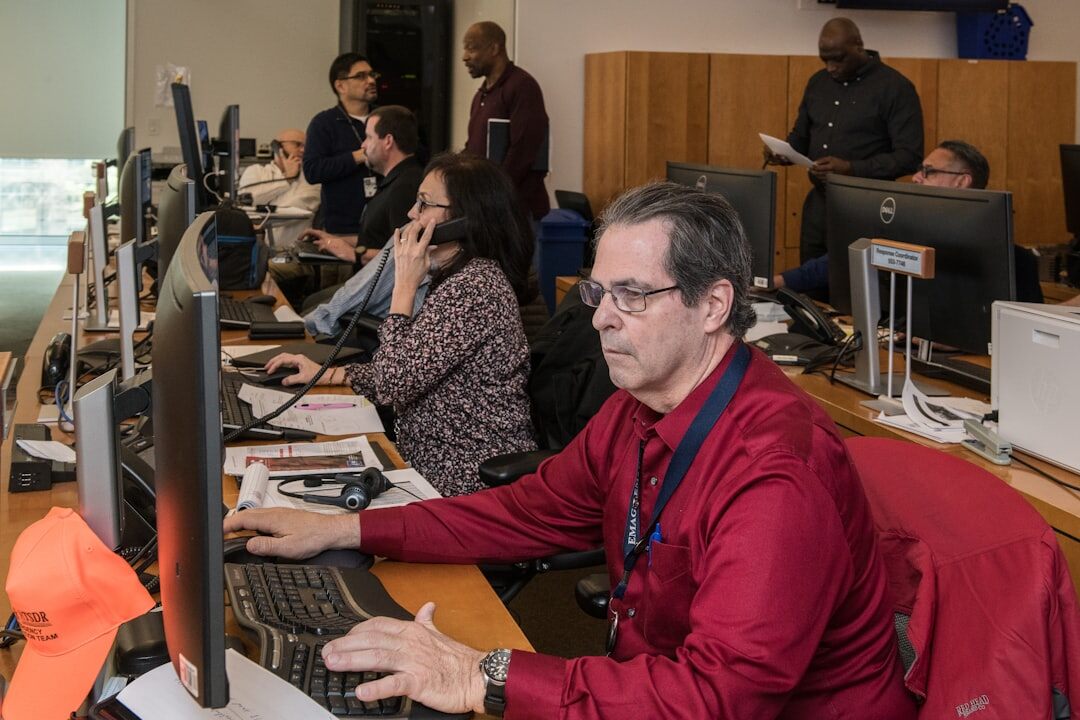 Diverse team of cybersecurity editors and researchers in an office